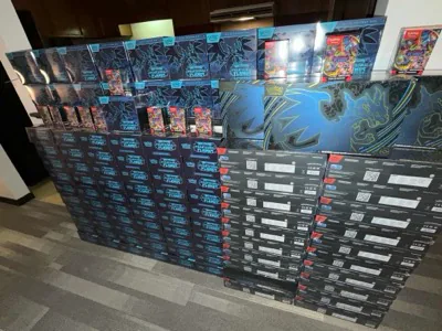 A wall of stacked Pokémon booster and Elite Trainer Boxes