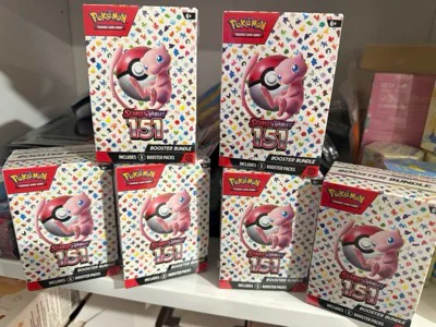 Pokémon Scarlet and Violet 151 booster bundles arranged on a shelf
