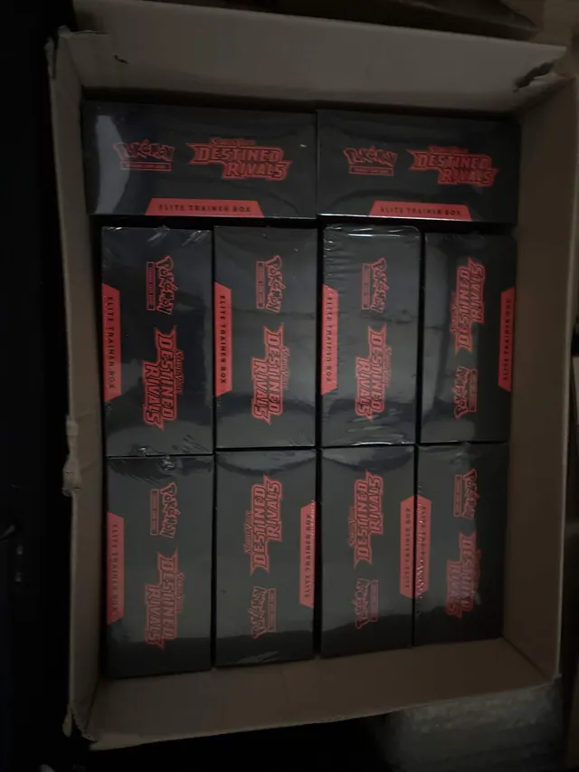 Destined Rivals Elite Trainer Boxes packed tightly inside an open carton.