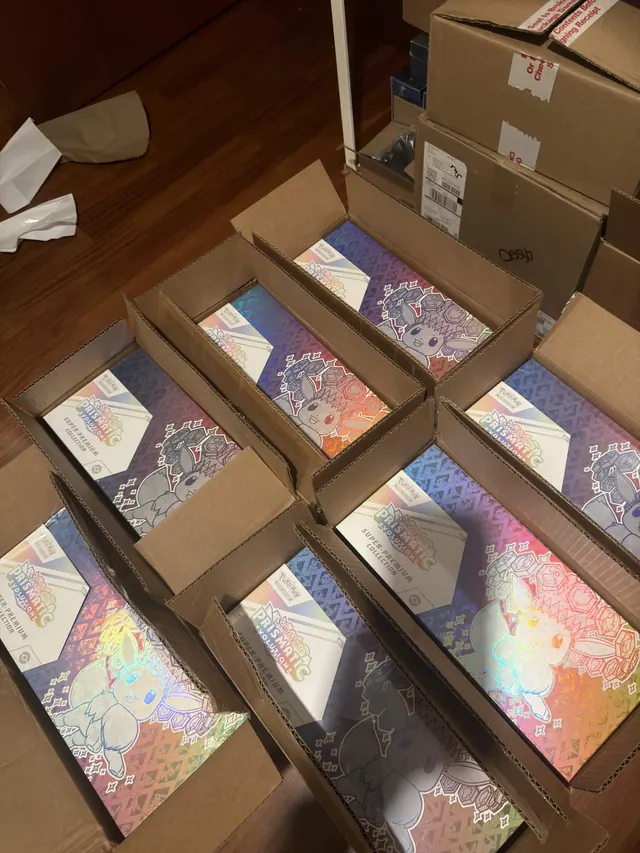 Prismatic Evolutions Super-Premium Collection boxes in open shipping cartons