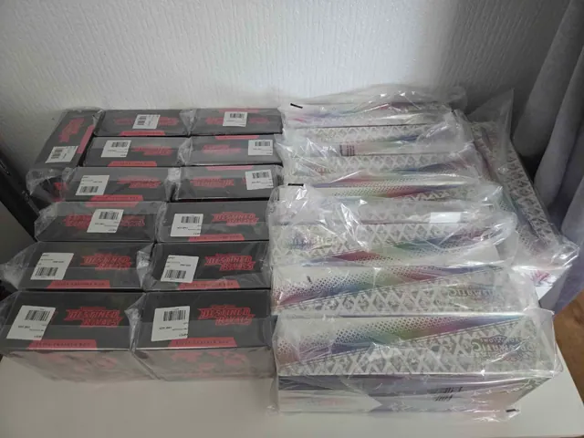 Sealed Destined Rivals and Prismatic Evolutions boxes arranged side by side.