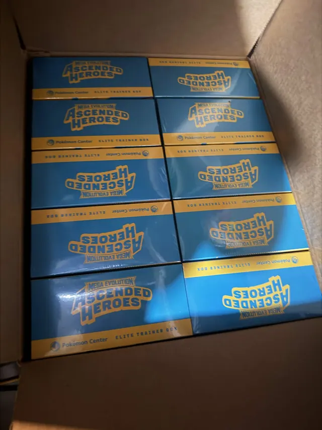 Ascended Heroes Pokémon Center Elite Trainer Boxes packed inside an open carton.
